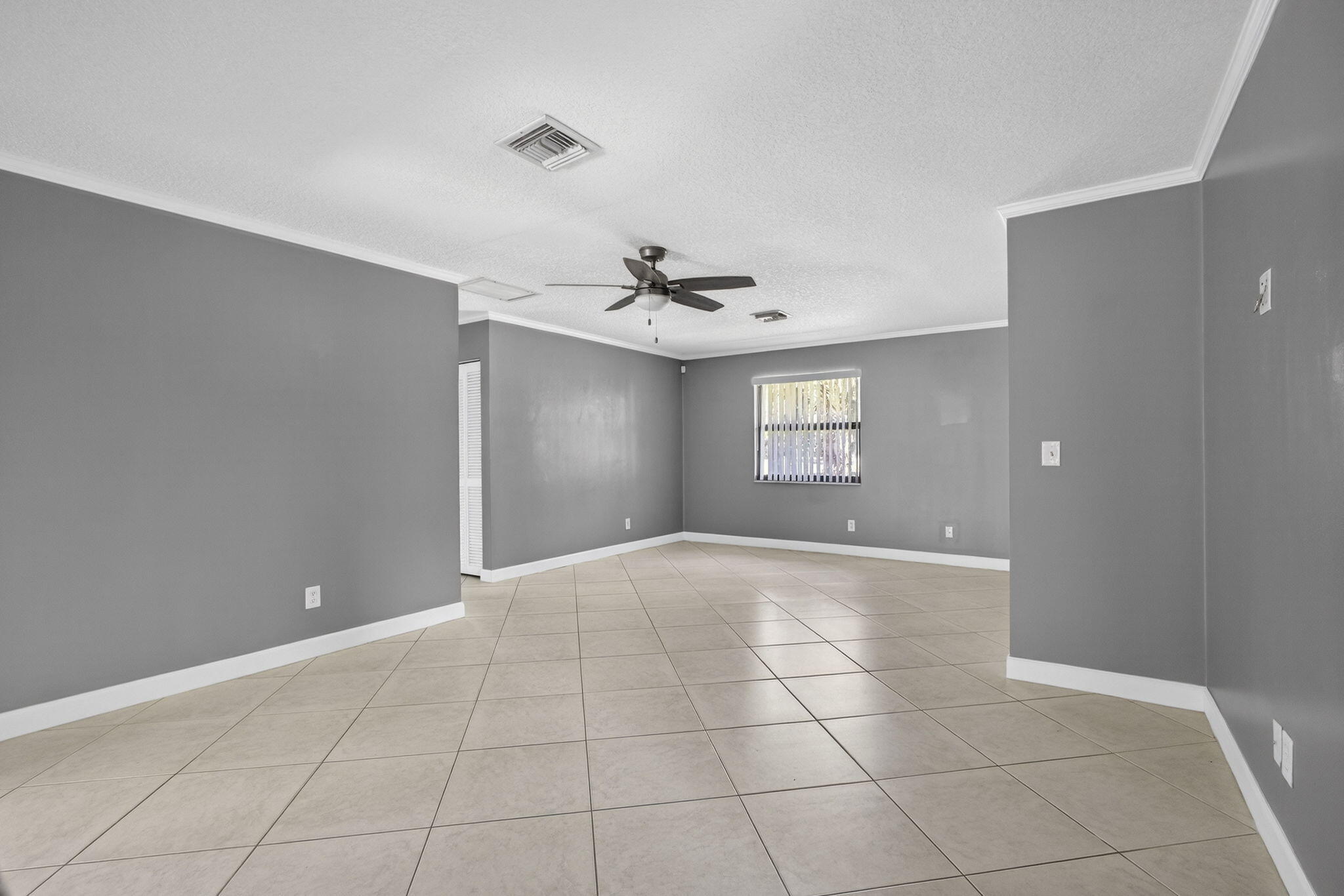 7107 181st Street Jupiter, FL 33458 - Photo 23 of 54 a view of an empty room and window