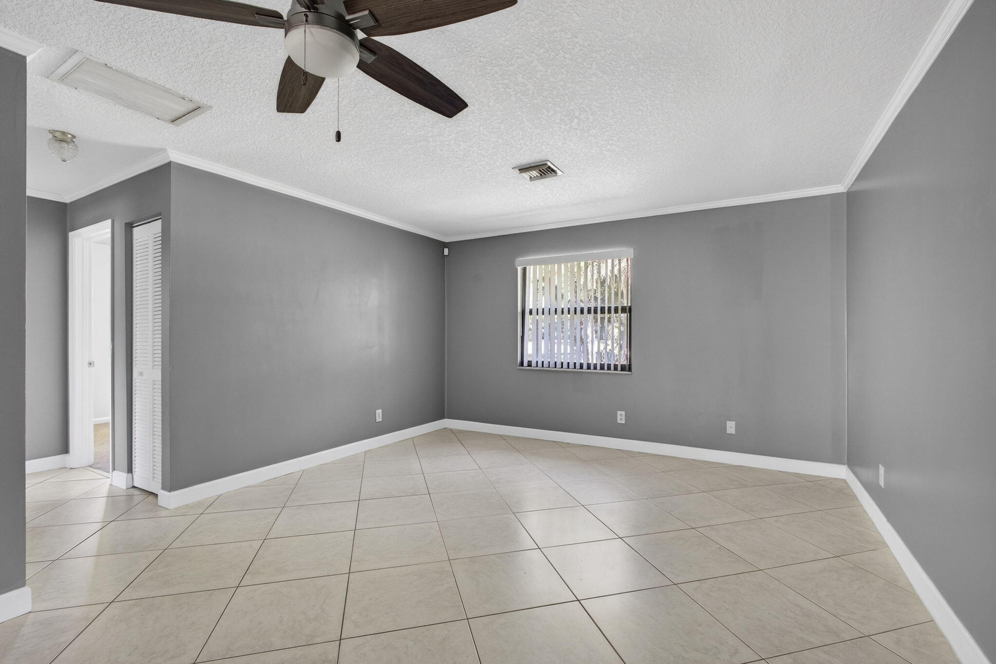 7107 181st Street Jupiter, FL 33458 - Photo 25 of 54 a view of an empty room with a window