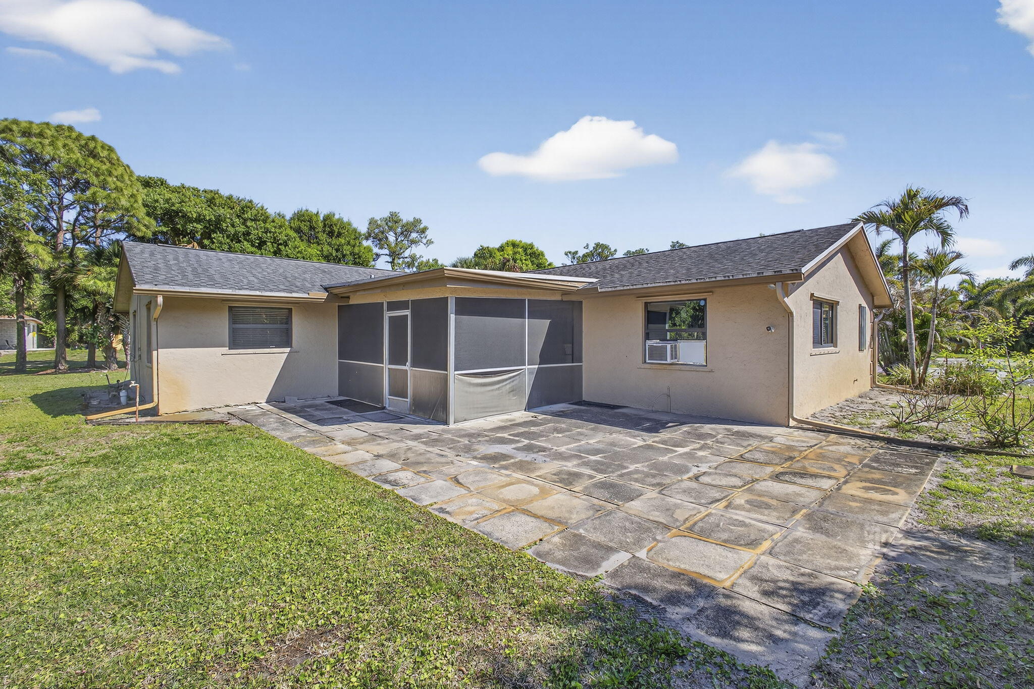 7107 181st Street Jupiter, FL 33458 - Photo 38 of 54 a view of a house with a patio