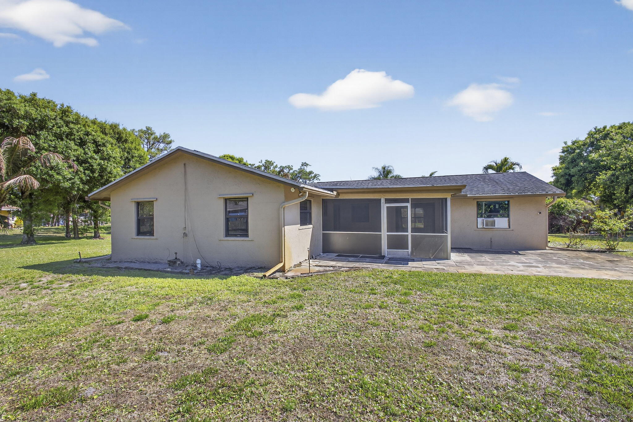 7107 181st Street Jupiter, FL 33458 - Photo 44 of 54 a house view with a garden space
