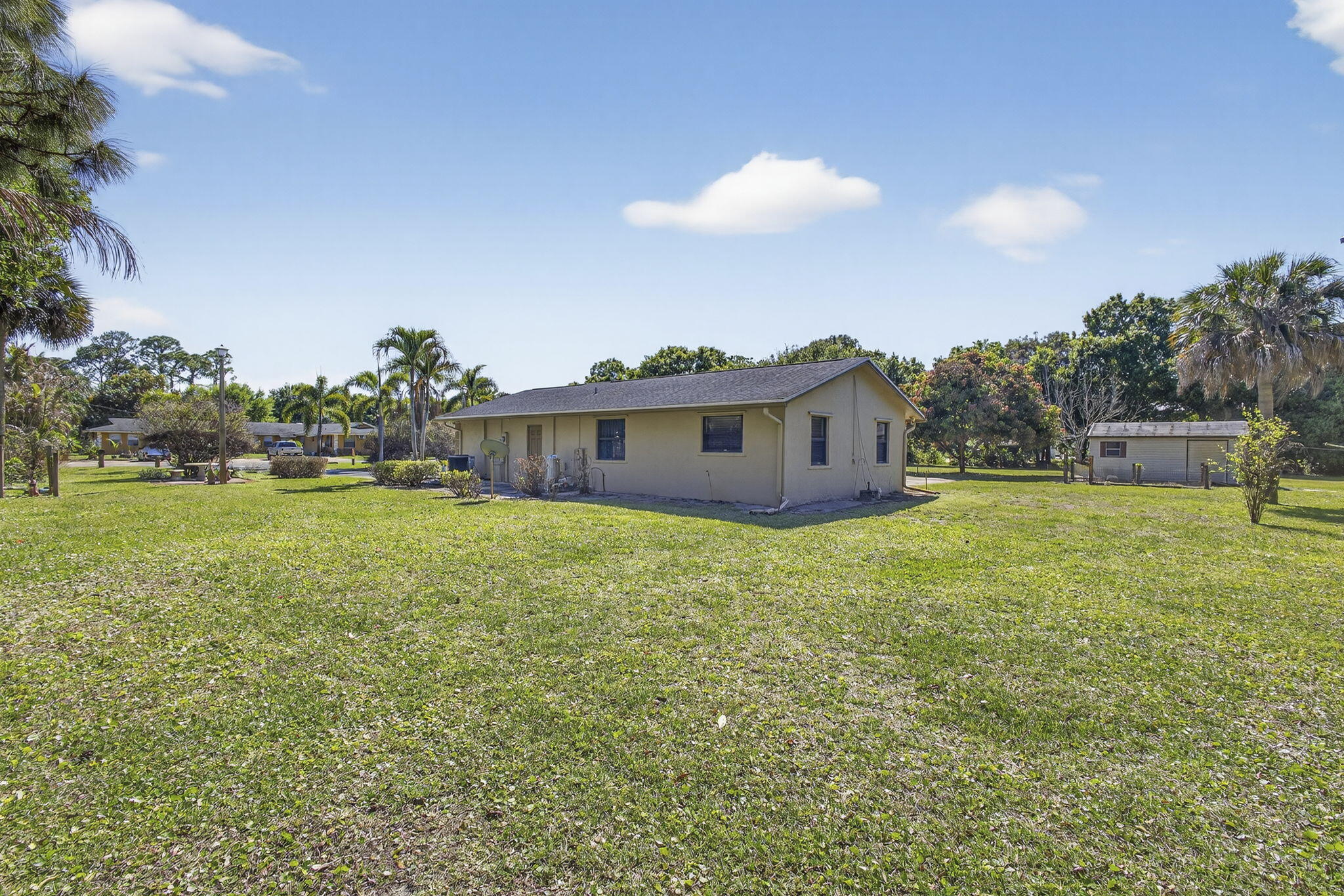 7107 181st Street Jupiter, FL 33458 - Photo 46 of 54 a view of a house with a backyard