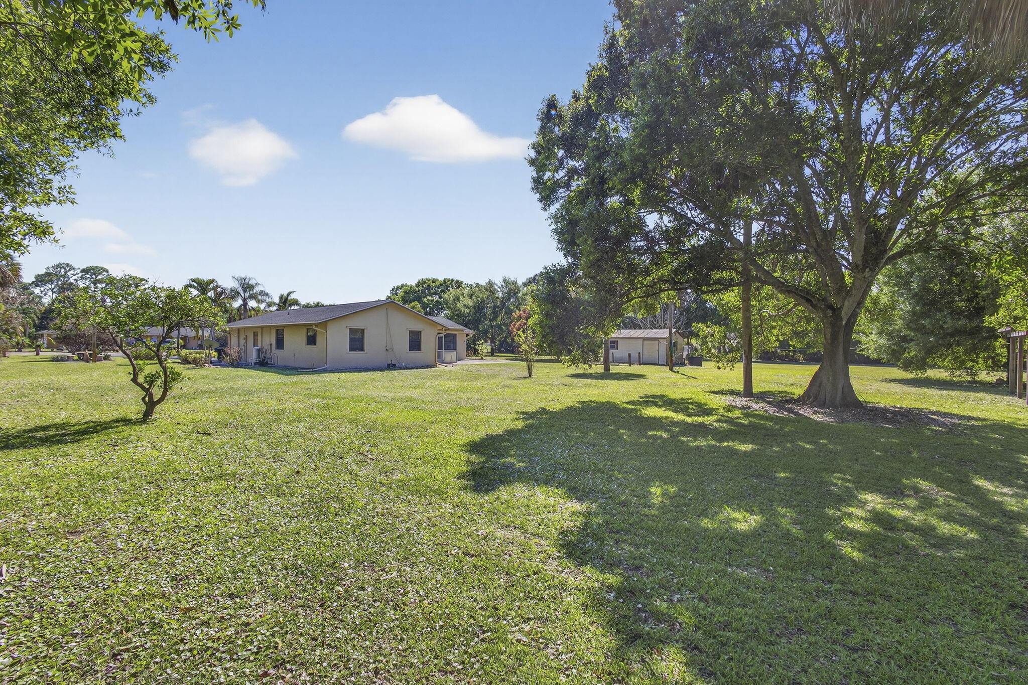 7107 181st Street Jupiter, FL 33458 - Photo 47 of 54 a view of a house with a yard