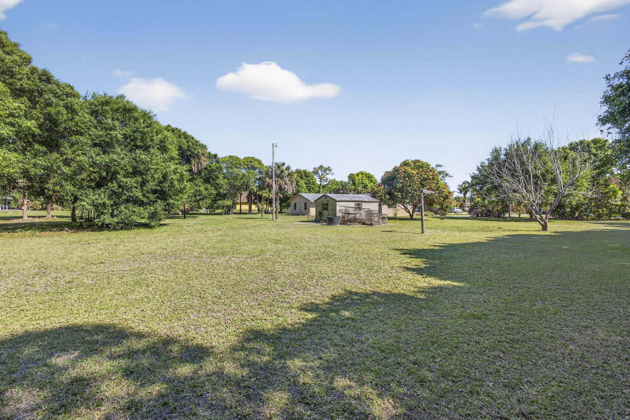 7107 181st Street Jupiter, FL 33458 - Photo 52 of 54 a view of a golf course with a lake