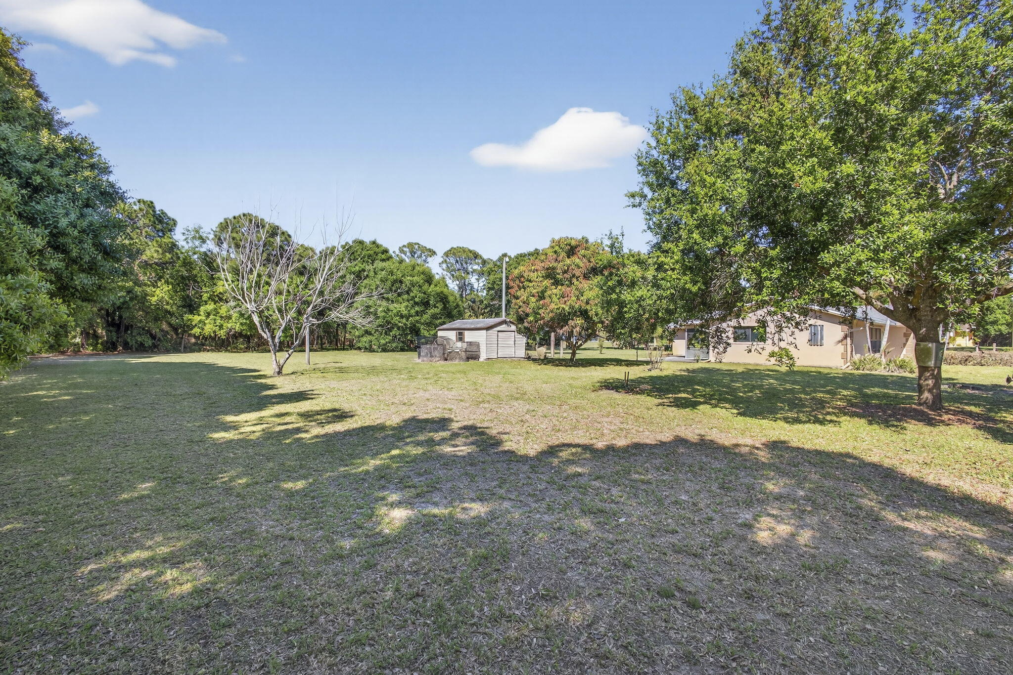 7107 181st Street Jupiter, FL 33458 - Photo 54 of 54 a view of dirt field with trees around