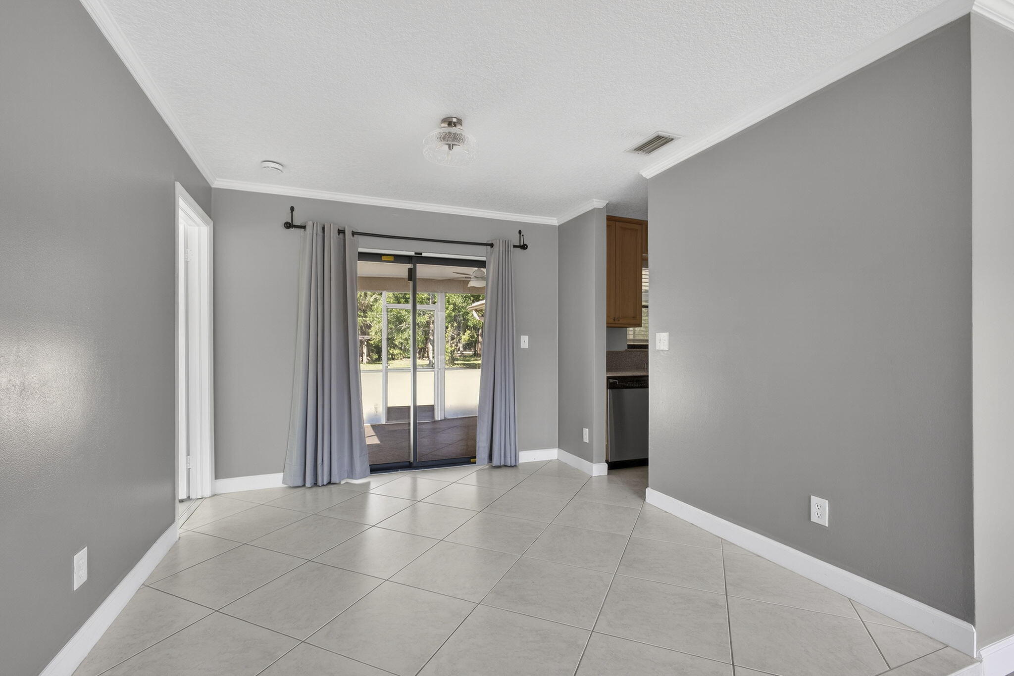 7107 181st Street Jupiter, FL 33458 - Photo 8 of 54 a view of an empty room with a window