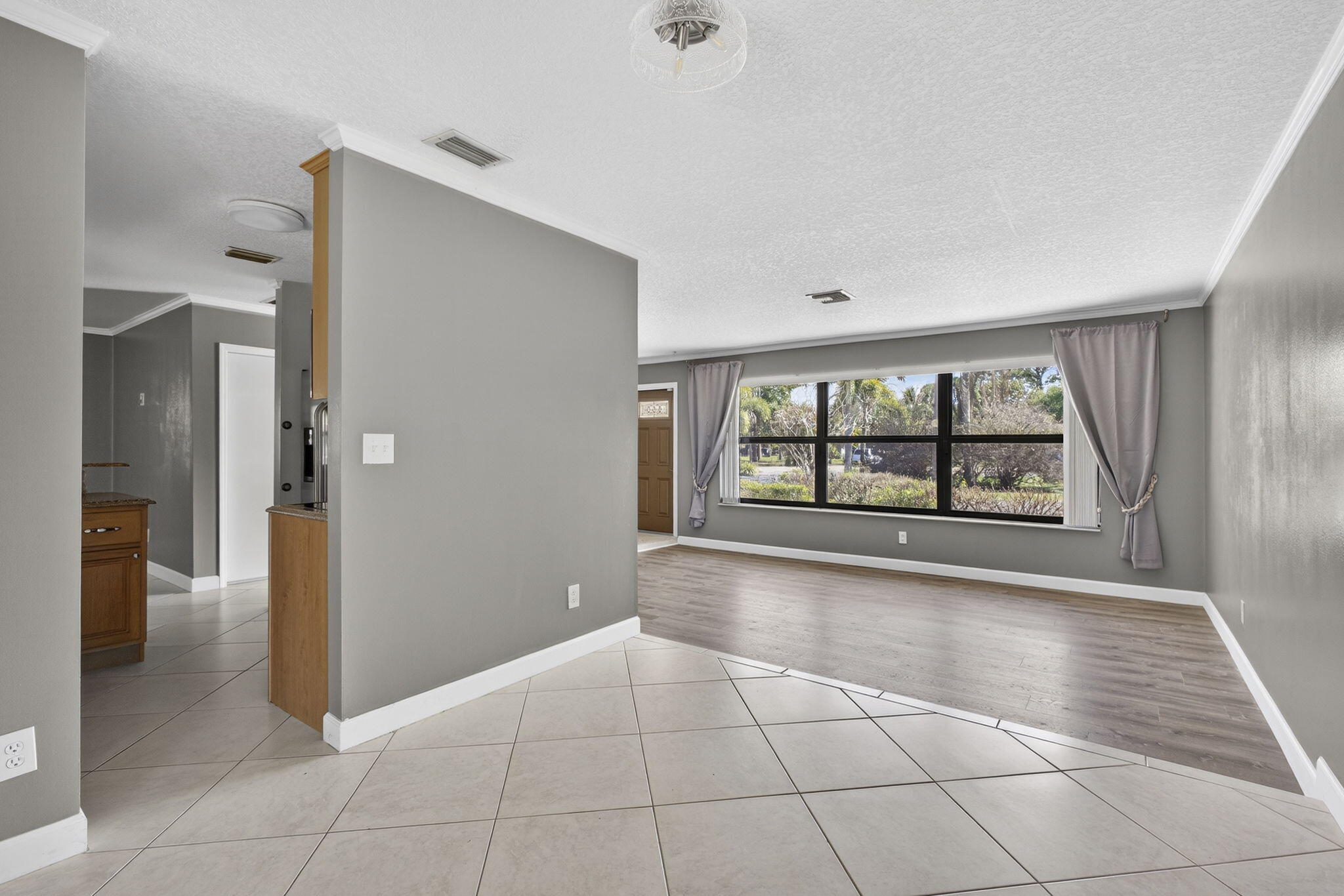 7107 181st Street Jupiter, FL 33458 - Photo 9 of 54 a view of an empty room with a window