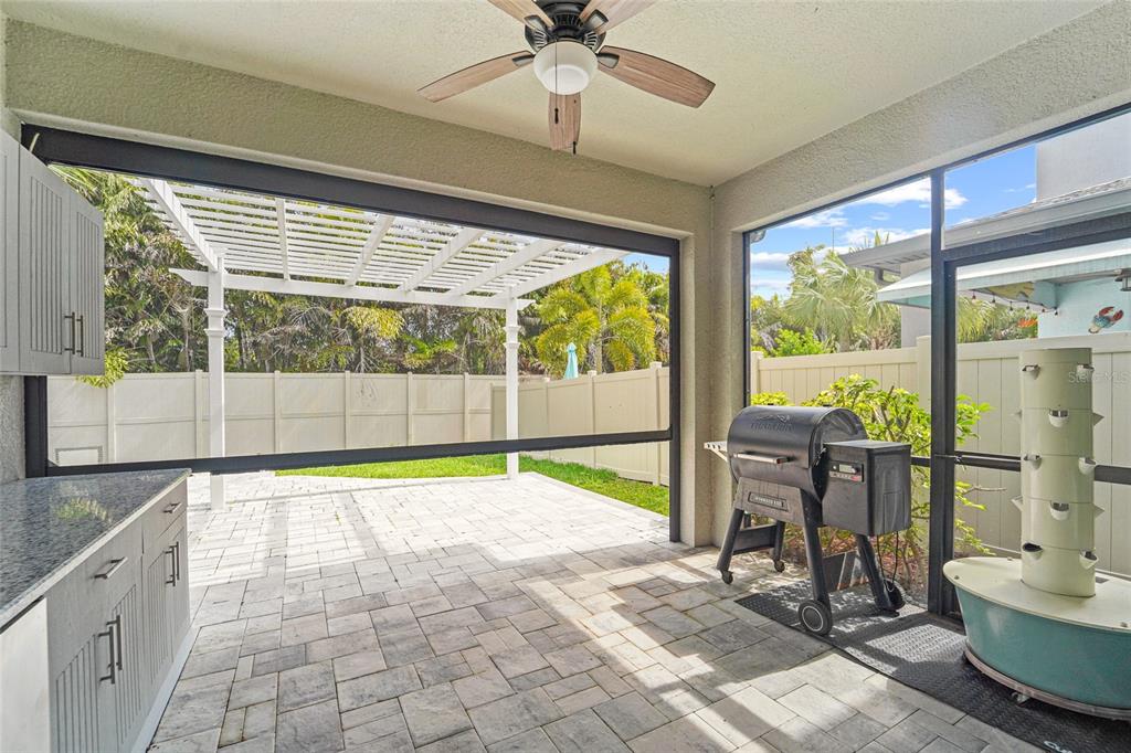 8903 Arabella Lane Seminole, FL 33777 - Photo 26 of 47 a view of a room with gym equipment and a large window