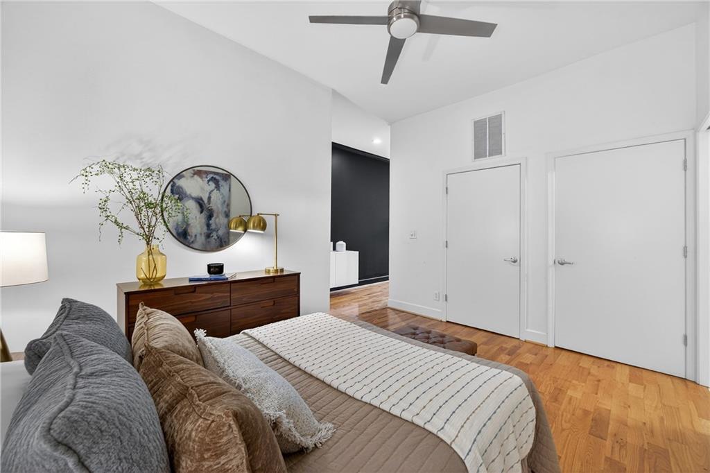 384 Ralph McGill Boulevard Northeast, Unit 322 Atlanta, GA 30312 - Photo 18 of 23 a bedroom with a bed and a dresser