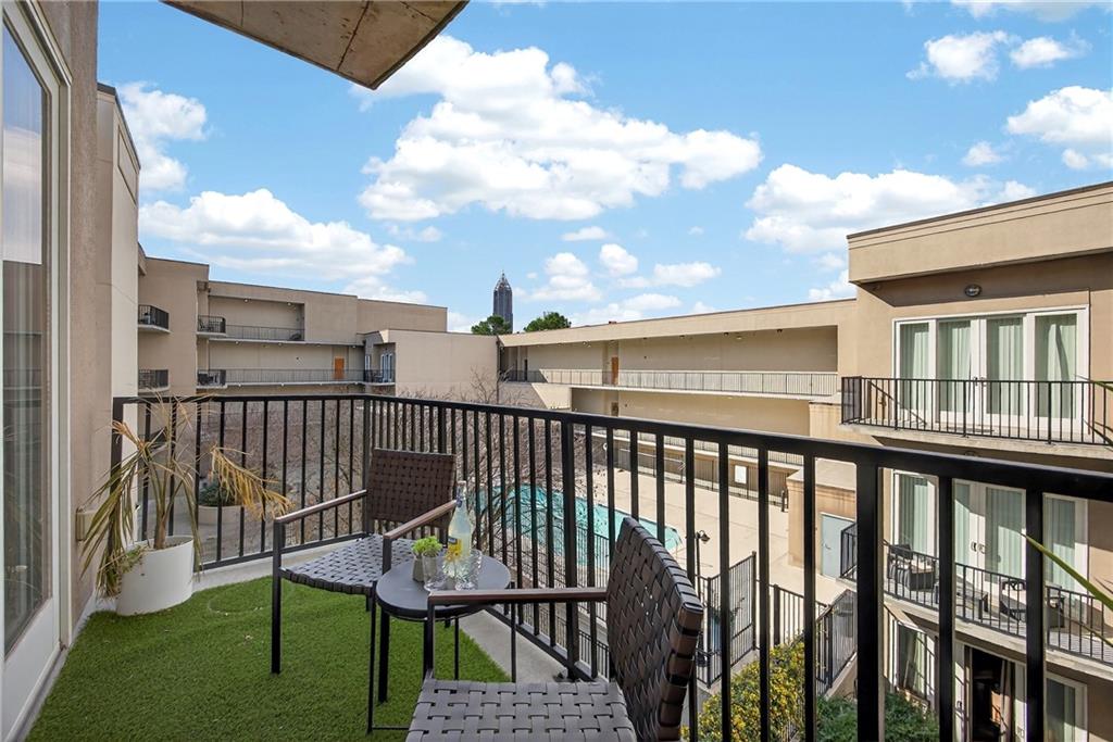 384 Ralph McGill Boulevard Northeast, Unit 322 Atlanta, GA 30312 - Photo 21 of 23 a view of a balcony with wooden fence