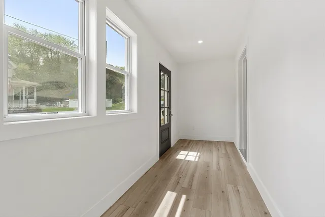 a view of entryway with wooden floor