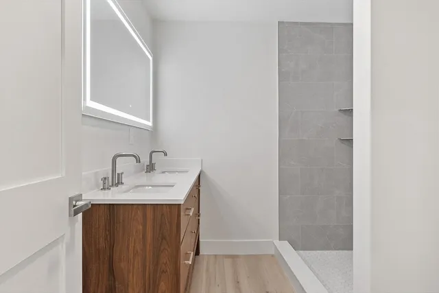 a bathroom with a sink and a mirror