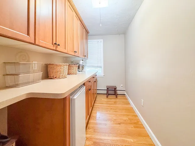 a hallway with washer and dryer