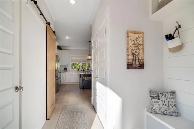 a view of a hallway with couch and furniture