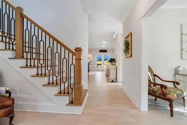 a view of a hallway with seating area