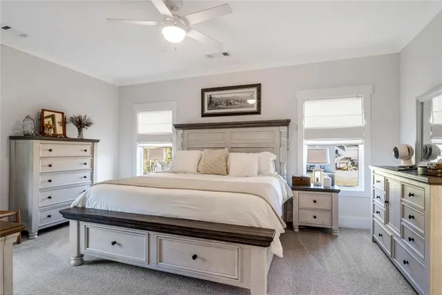 a living room with a bed and a flat screen tv