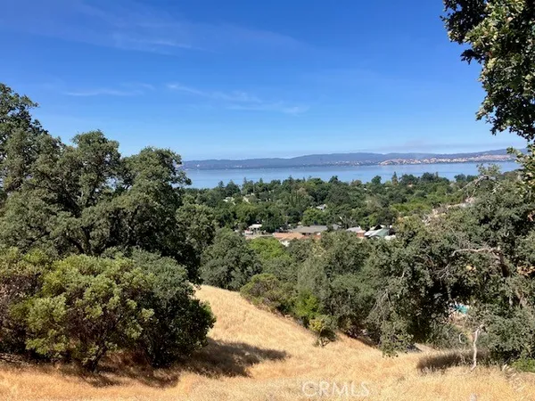 a view of a city and mountains in the background
