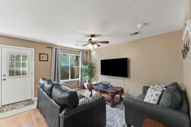 a view of a backyard with sitting area