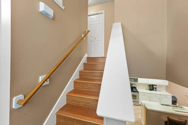 a bathroom with a granite countertop sink and a large mirror