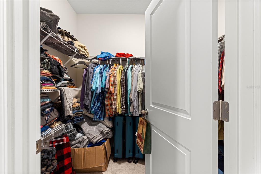 8142 Southwest 59th Avenue Ocala, FL 34476 - Photo 27 of 54 a view of walk in closet with clothes