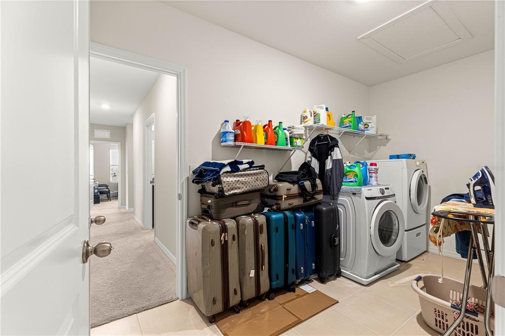 8142 Southwest 59th Avenue Ocala, FL 34476 - Photo 31 of 54 a utility room with multiple dryer and washer
