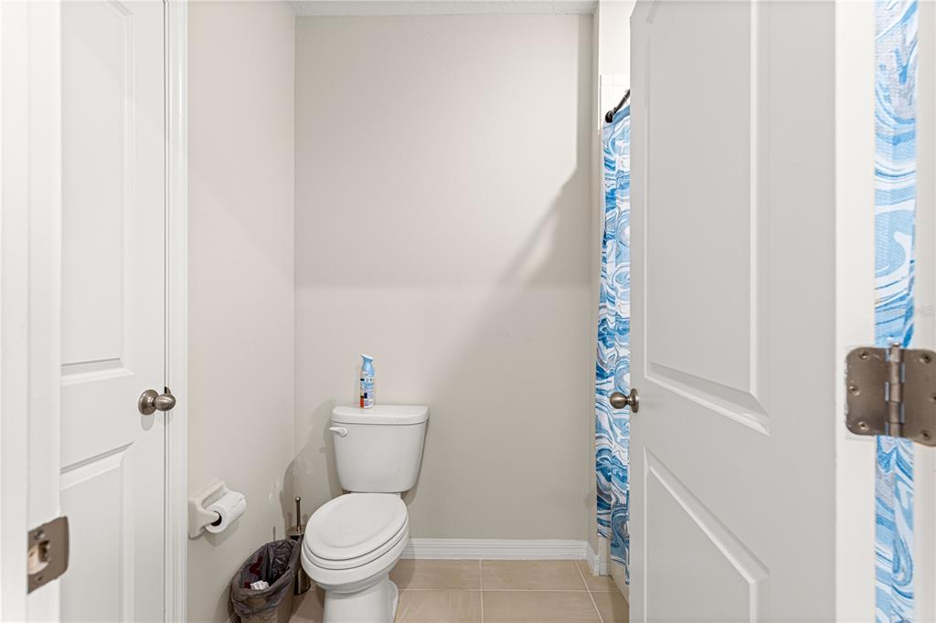 8142 Southwest 59th Avenue Ocala, FL 34476 - Photo 36 of 54 a white toilet sitting next to a shower