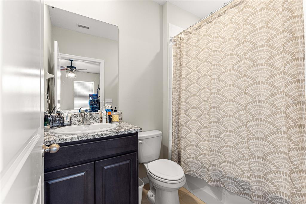 8142 Southwest 59th Avenue Ocala, FL 34476 - Photo 38 of 54 a bathroom with a granite countertop sink and a toilet
