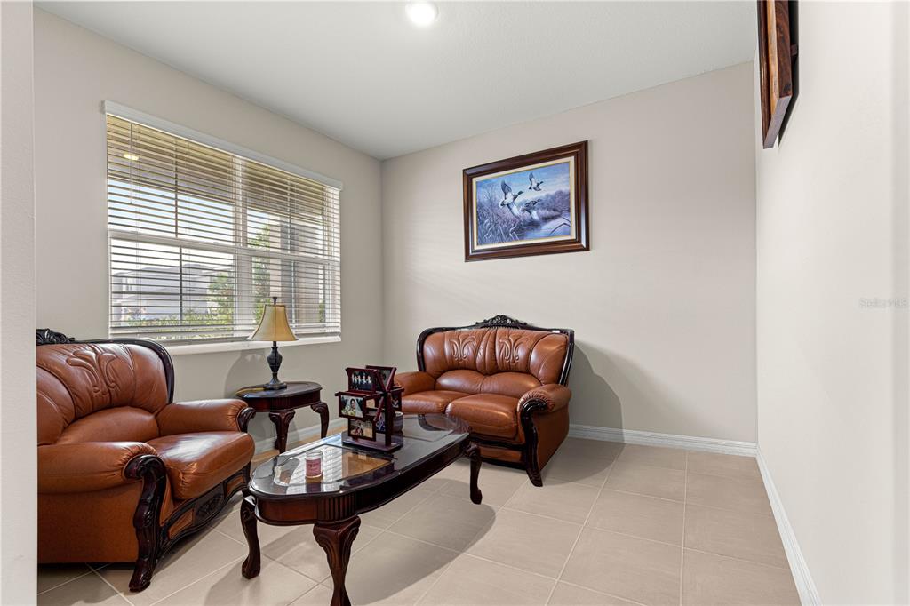 8142 Southwest 59th Avenue Ocala, FL 34476 - Photo 5 of 54 a living room with furniture and a window