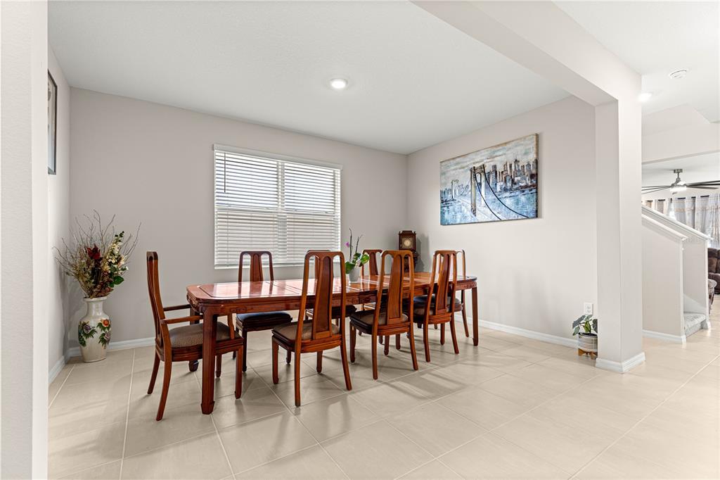 8142 Southwest 59th Avenue Ocala, FL 34476 - Photo 6 of 54 a view of a dining room with furniture