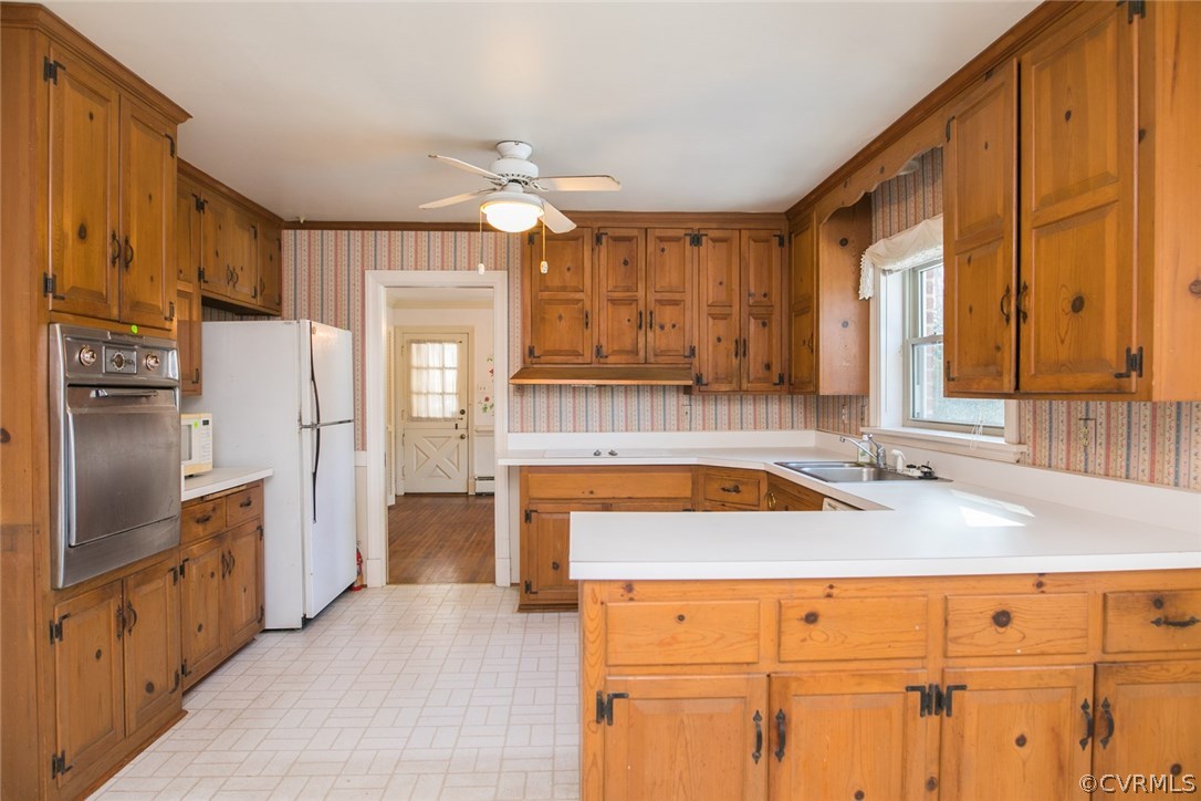 8013 Thom Road Henrico, VA 23229 - Photo 12 of 40 a kitchen with refrigerator cabinets and large window