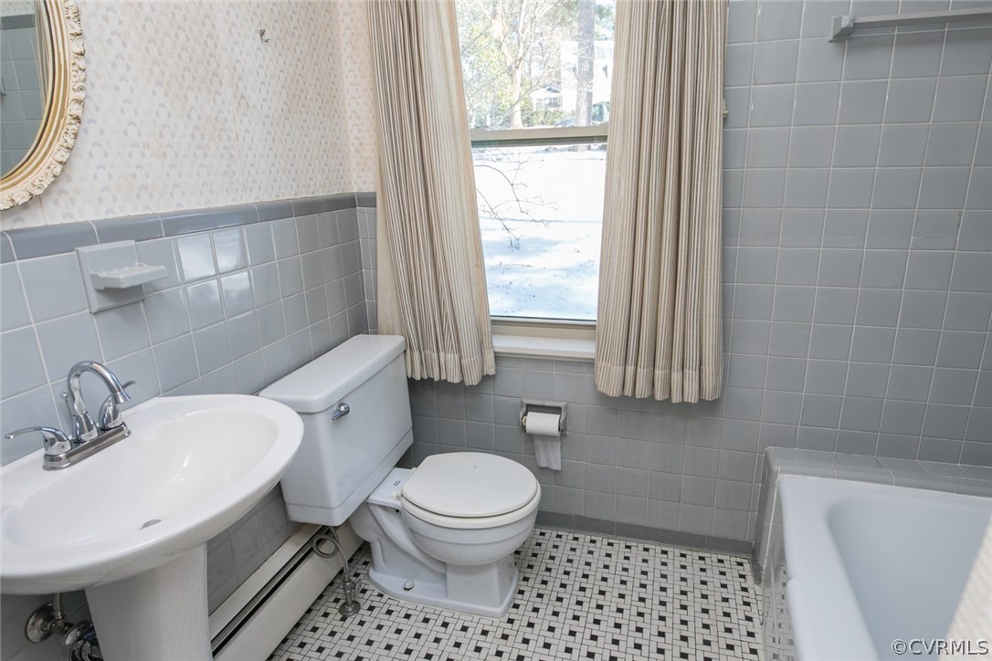 8013 Thom Road Henrico, VA 23229 - Photo 14 of 40 a bathroom with a sink a toilet and a mirror
