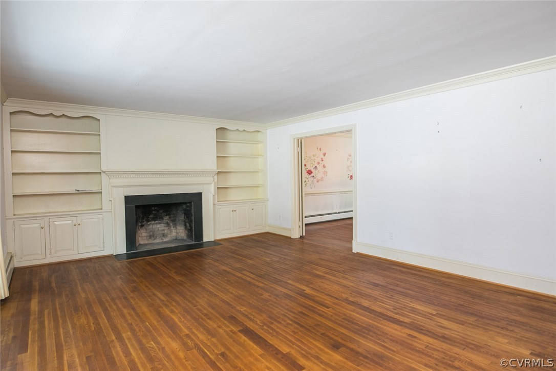 8013 Thom Road Henrico, VA 23229 - Photo 18 of 40 a view of empty room with wooden floor and fireplace