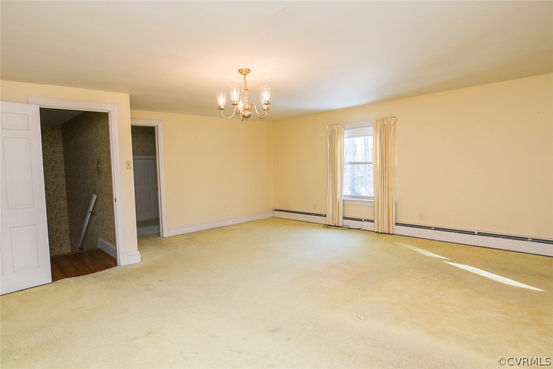 8013 Thom Road Henrico, VA 23229 - Photo 24 of 40 an empty room with a chandelier fan and windows