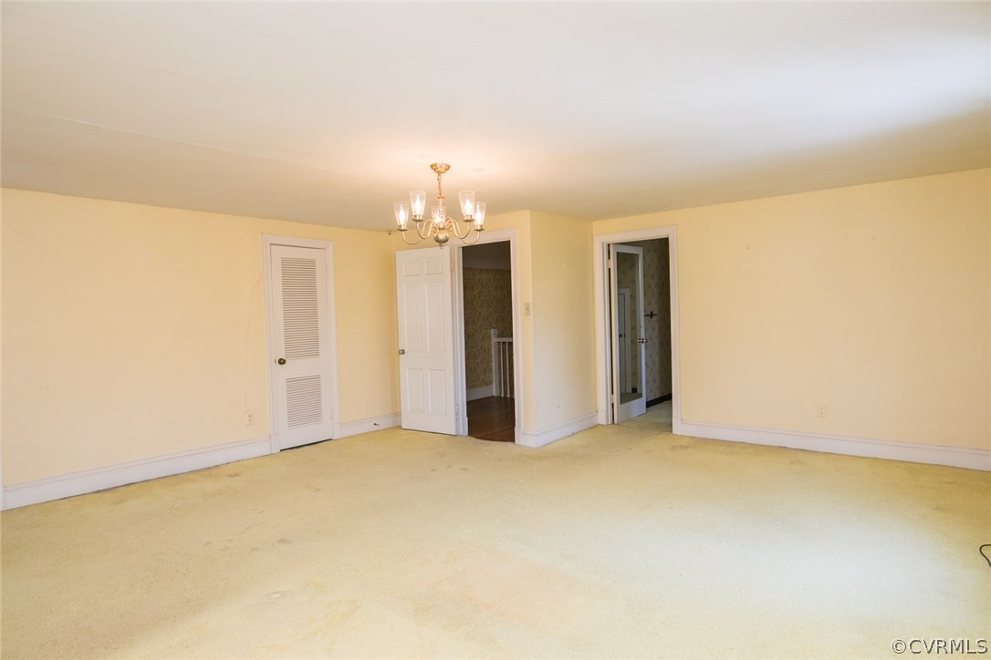 8013 Thom Road Henrico, VA 23229 - Photo 25 of 40 a view of an empty room with a chandelier
