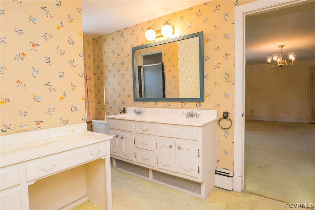 8013 Thom Road Henrico, VA 23229 - Photo 27 of 40 a bathroom with a sink and a mirror