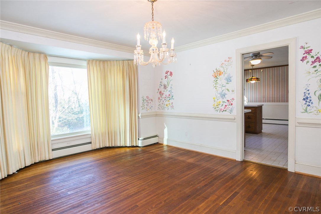 8013 Thom Road Henrico, VA 23229 - Photo 4 of 40 an empty room with wooden floor chandelier and windows