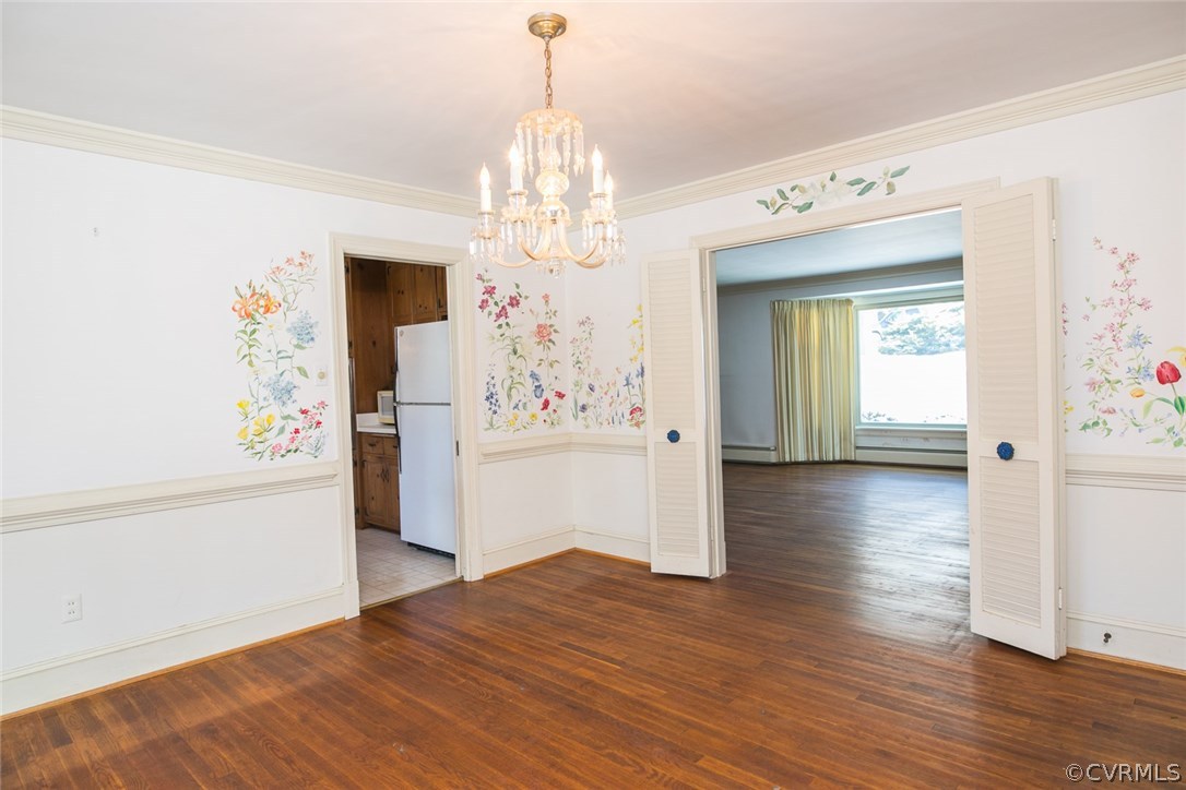 8013 Thom Road Henrico, VA 23229 - Photo 5 of 40 a view of a hallway with wooden floor and chandelier