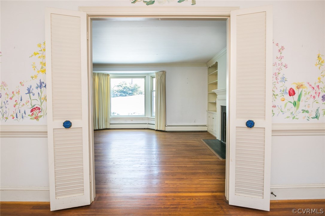8013 Thom Road Henrico, VA 23229 - Photo 6 of 40 a view of an entryway with wooden floor