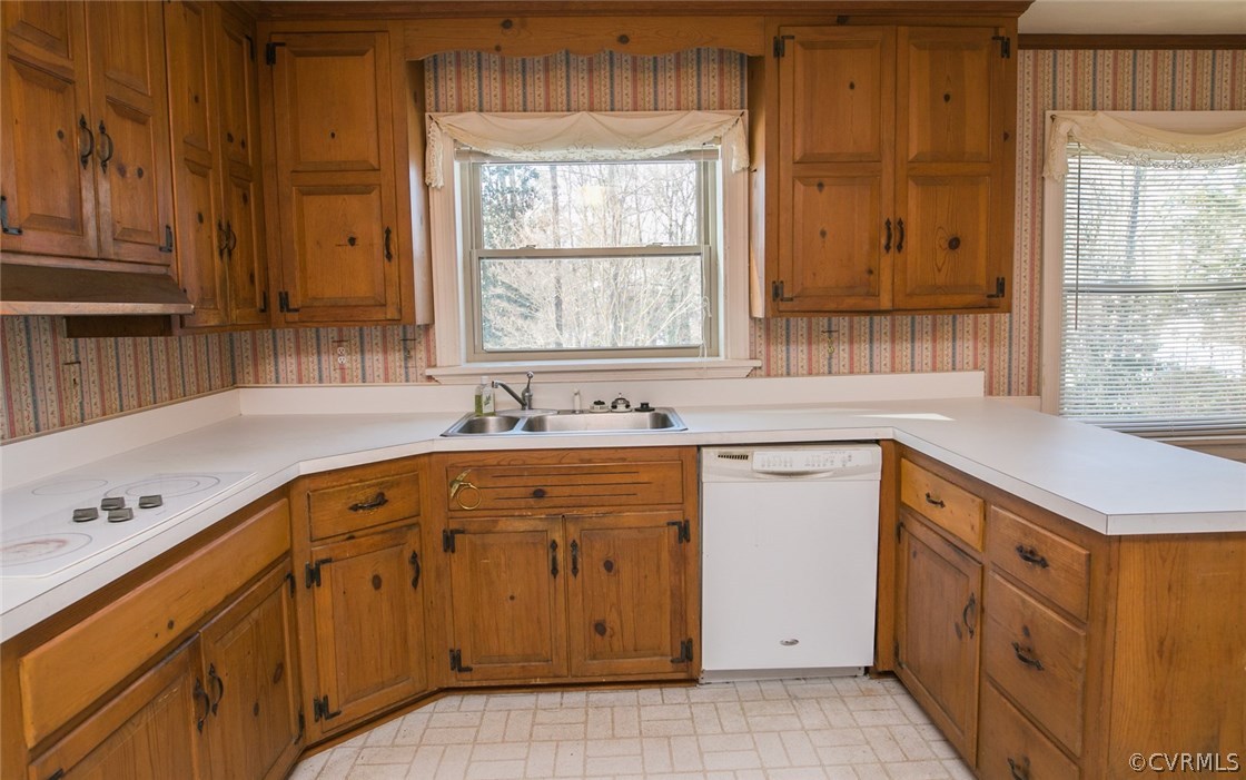 8013 Thom Road Henrico, VA 23229 - Photo 9 of 40 a kitchen with stainless steel appliances granite countertop a sink dishwasher a stove and a refrigerator with wooden cabinets