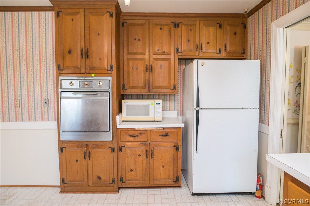 8013 Thom Road Henrico, VA 23229 - Photo 10 of 40 a kitchen with stainless steel appliances granite countertop a refrigerator and a stove