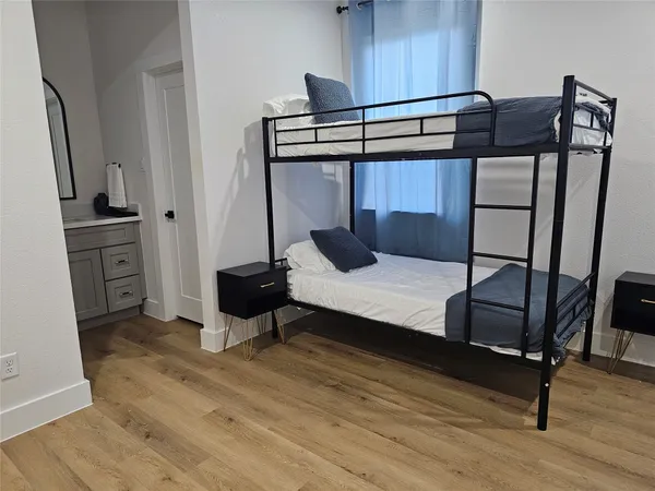 a bedroom with a bed and cabinets