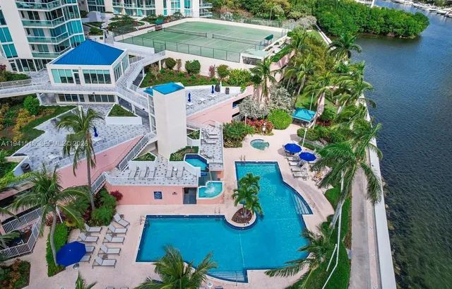 an aerial view of residential house with outdoor space and swimming pool