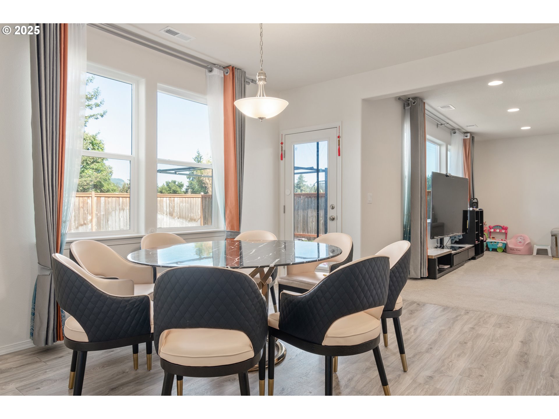 5292 Squirrel Street Springfield, OR 97478 - Photo 11 of 34 a view of a dining room with furniture and a large window