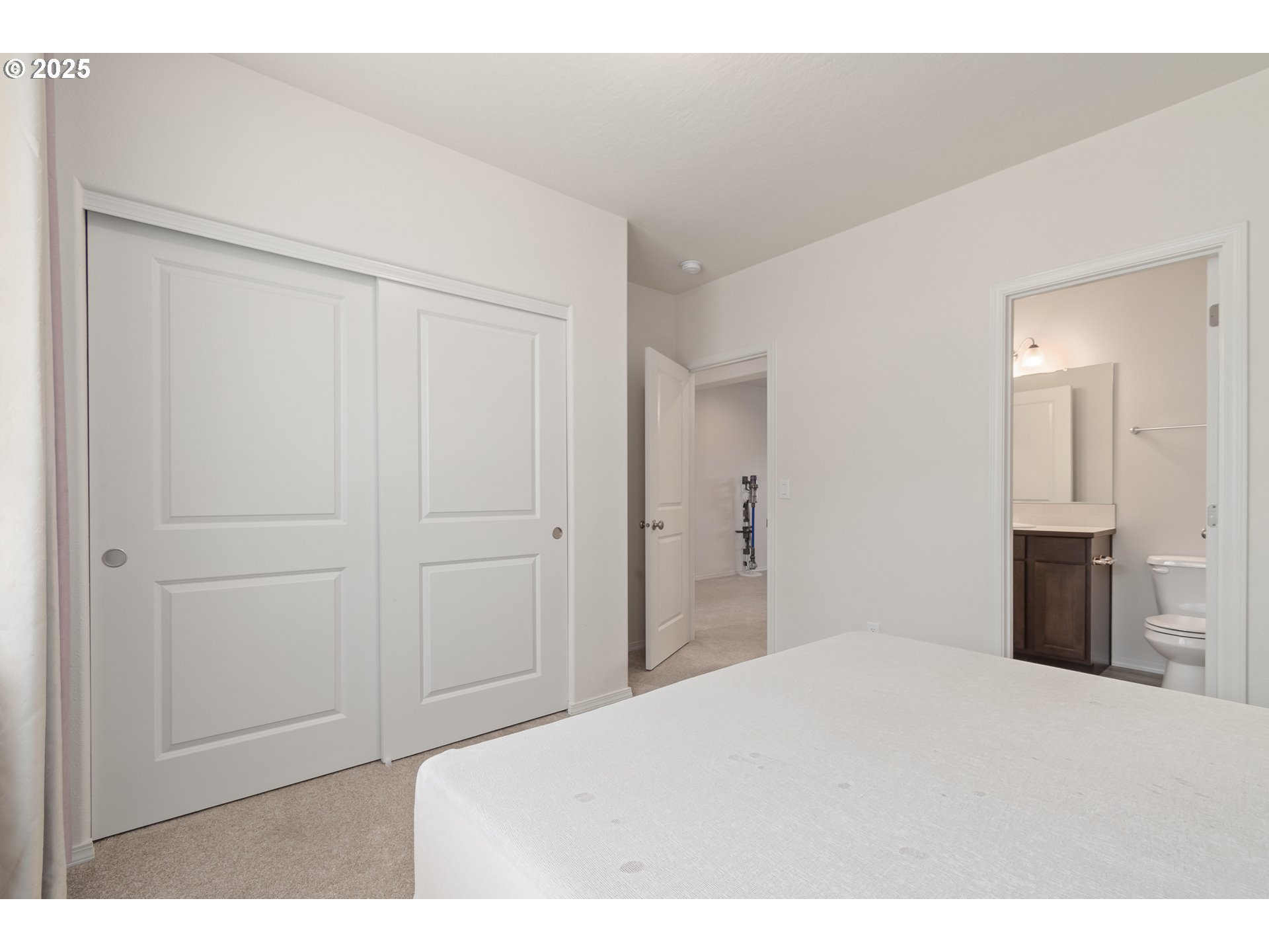 5292 Squirrel Street Springfield, OR 97478 - Photo 15 of 34 a bedroom with a bed and a mirror