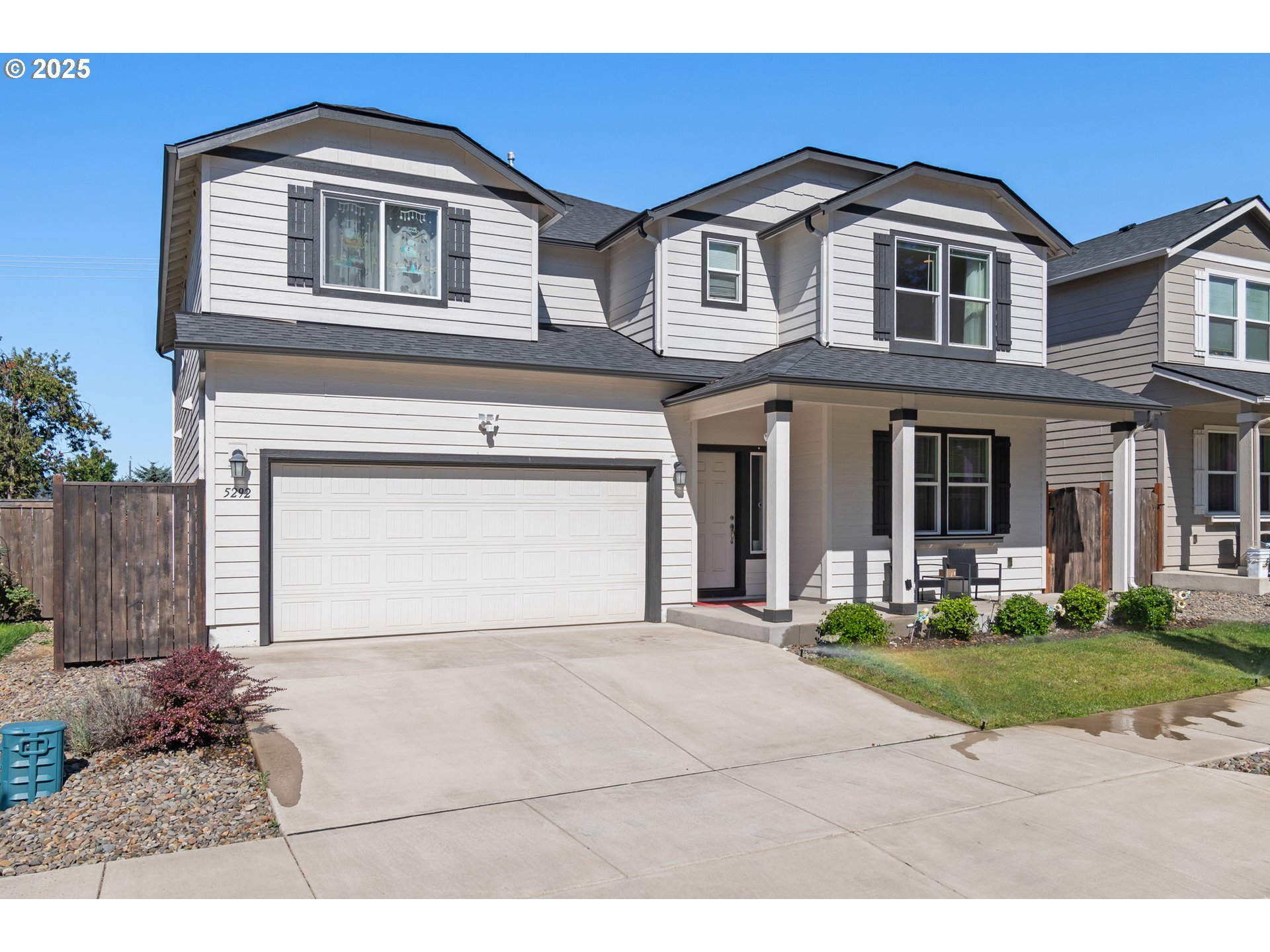 5292 Squirrel Street Springfield, OR 97478 - Photo 2 of 34 a front view of a house with a yard and garage