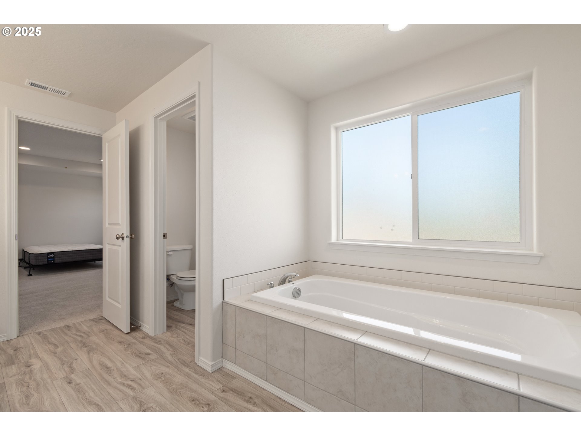 5292 Squirrel Street Springfield, OR 97478 - Photo 22 of 34 a bathroom with a bathtub and a shower