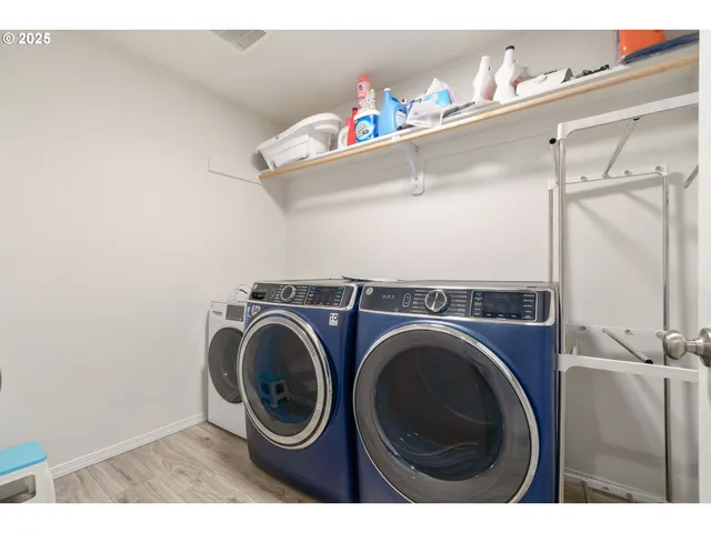a living room with a bed and a window