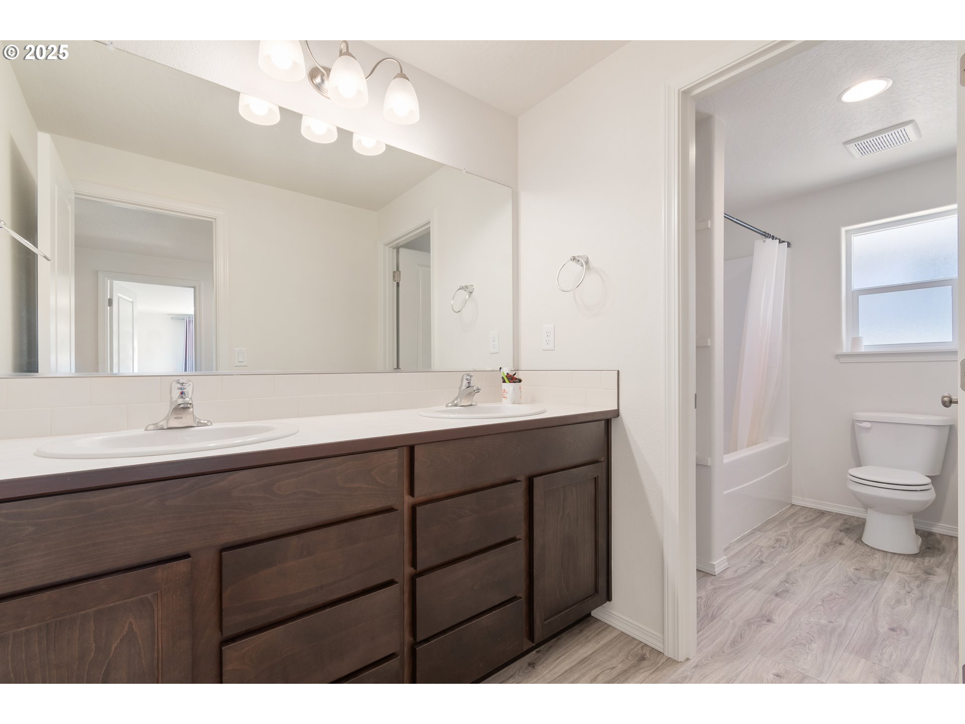 5292 Squirrel Street Springfield, OR 97478 - Photo 28 of 34 a bathroom with a sink a toilet and a mirror