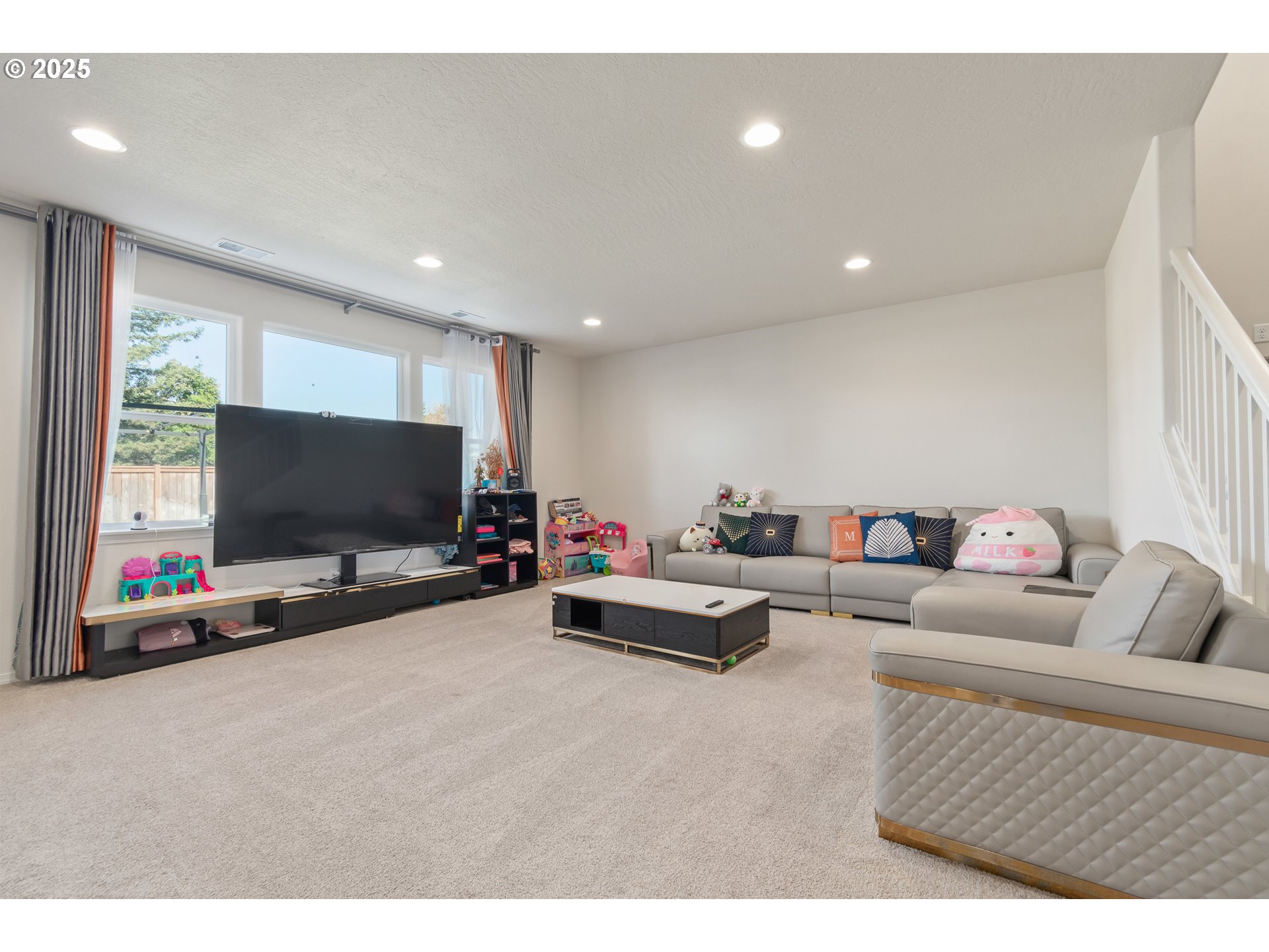 5292 Squirrel Street Springfield, OR 97478 - Photo 5 of 34 a living room with furniture and a flat screen tv