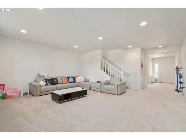 a living room with furniture and a couch