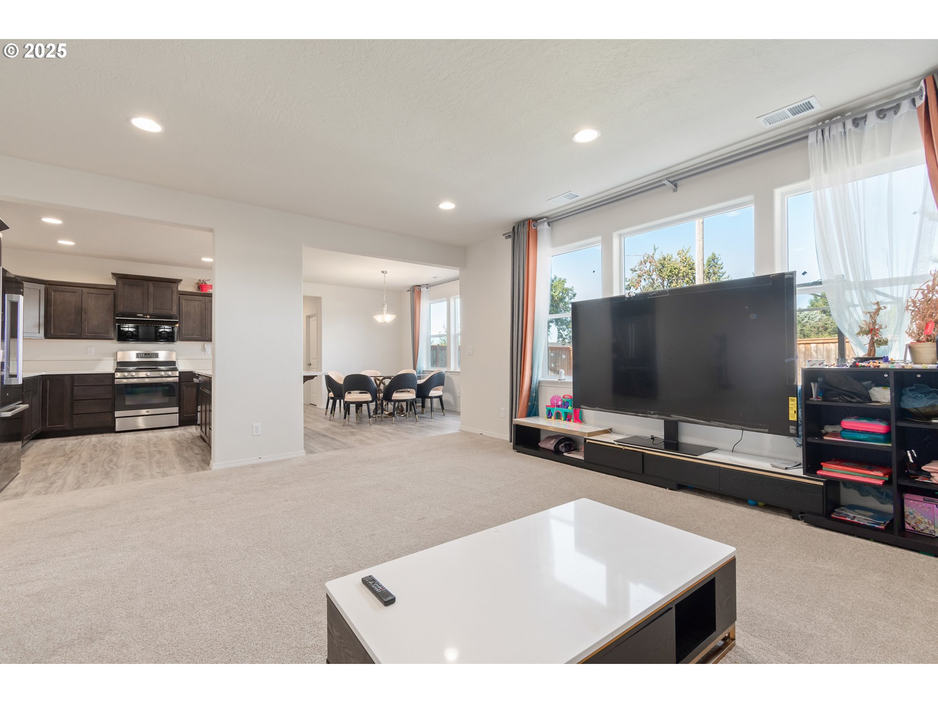 5292 Squirrel Street Springfield, OR 97478 - Photo 7 of 34 a living room with furniture and a flat screen tv